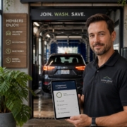 Man standing in front of car wash tunnel